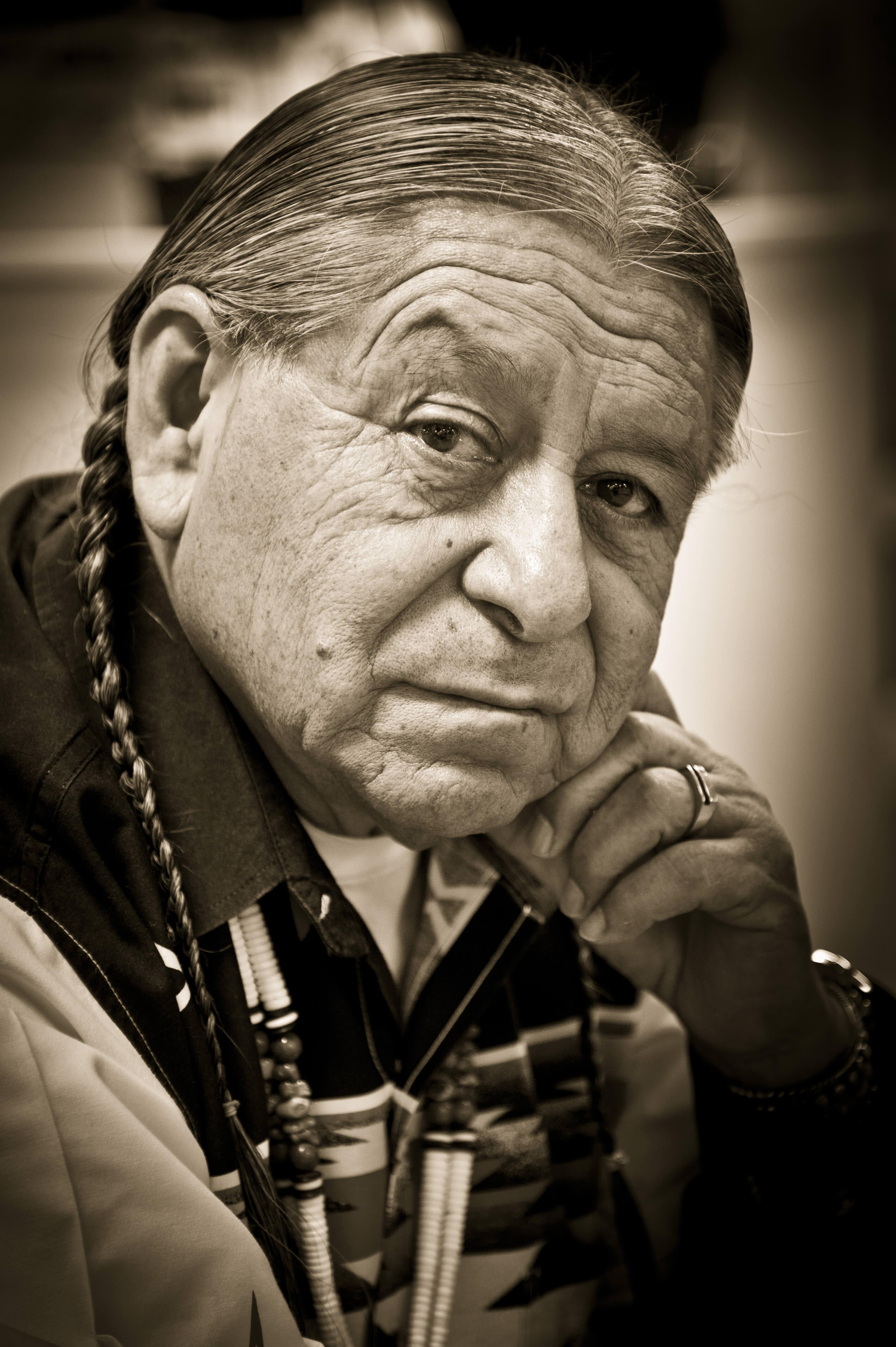 A photo of a Native American man, in a post examining long hair in Native American culture. 