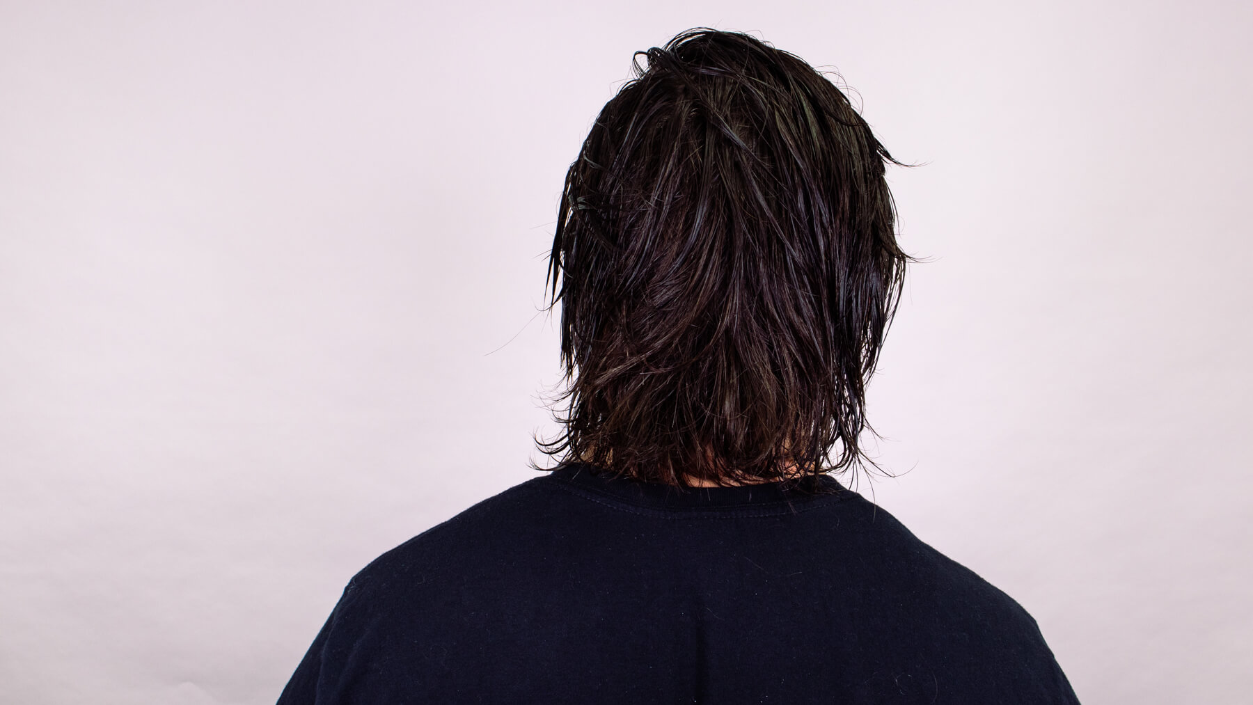 Back view of stylish young bearded man with modern hairstyle  CanStock