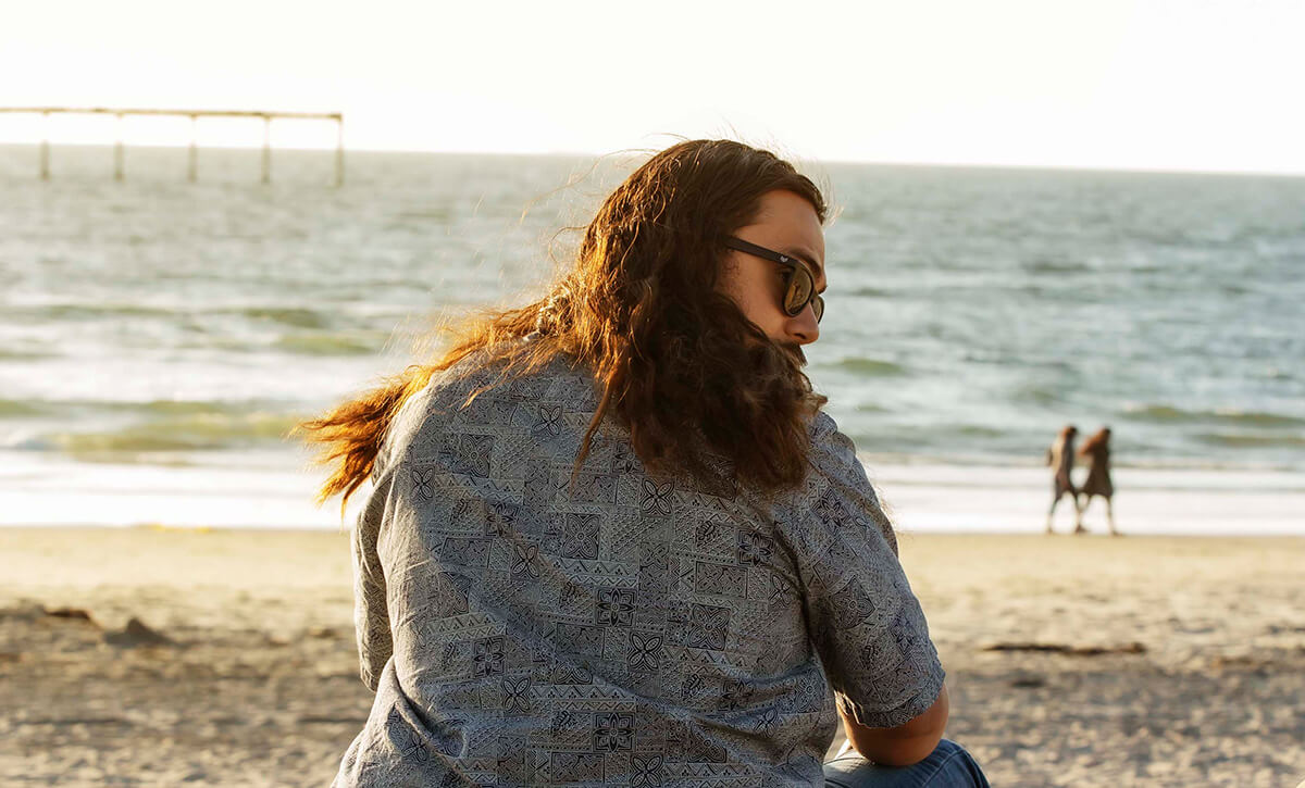 El Sicario thinking about how nutrition for healthy hair affects his life