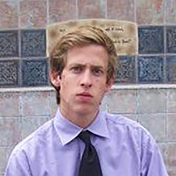 A picture of Chuck in high school, at 18 years old with THICK, all caps THICK hair. FLOW. Incredible. I remember that guy.