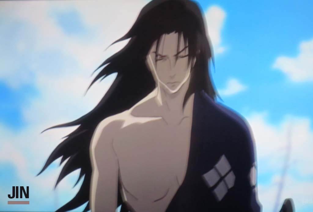 Jin walking forward through a blue cloudy sky ready to attack as his long hair in anime flows around him.