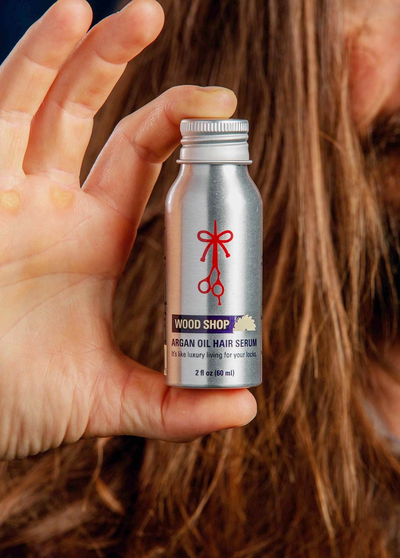 A close up of the bottle from the Wood Shop fragrance product from The Longhairs