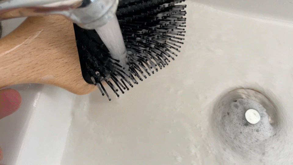 Rinsing The Continental paddle brush, how to clean your hair brush