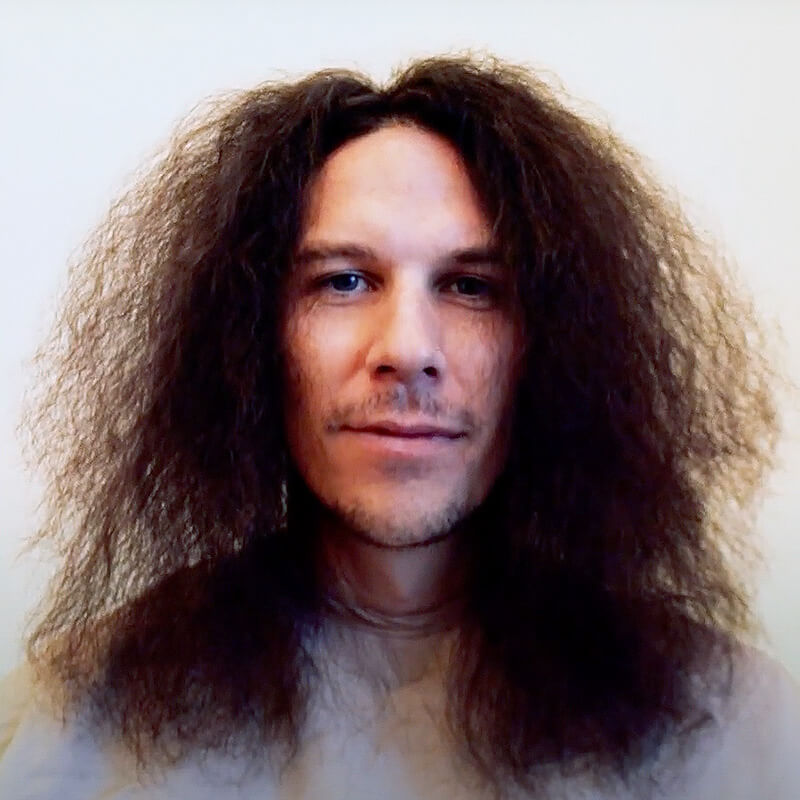Man with long curly hair