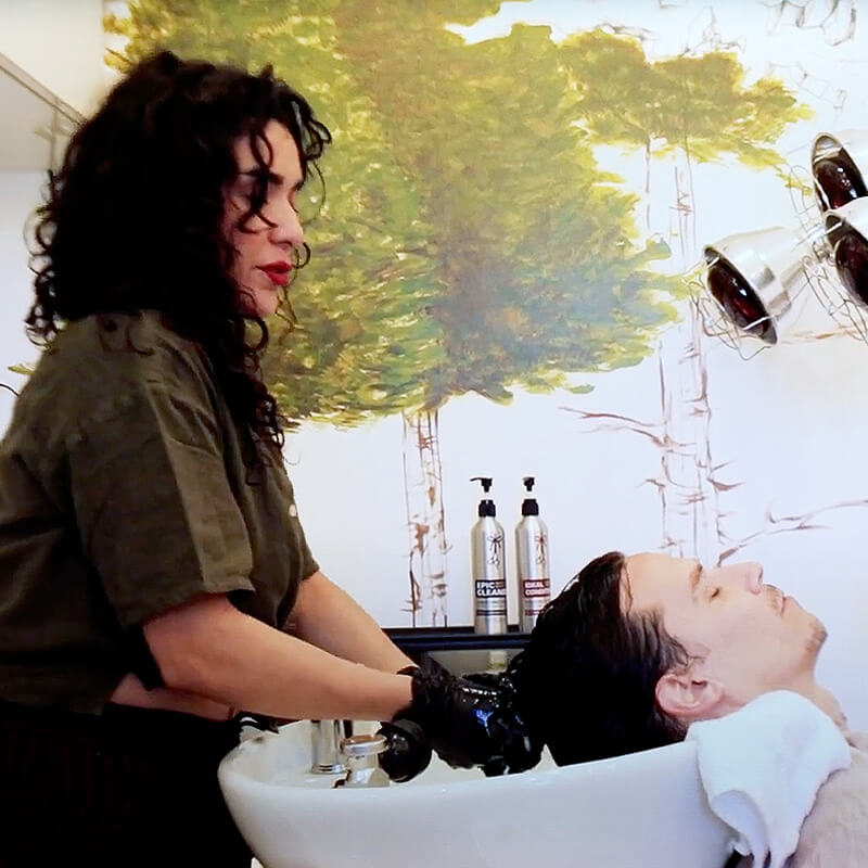 Naomi trimming the curly hair