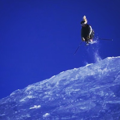 El Rubio bursting off a cornice with ponytail flying behind him 