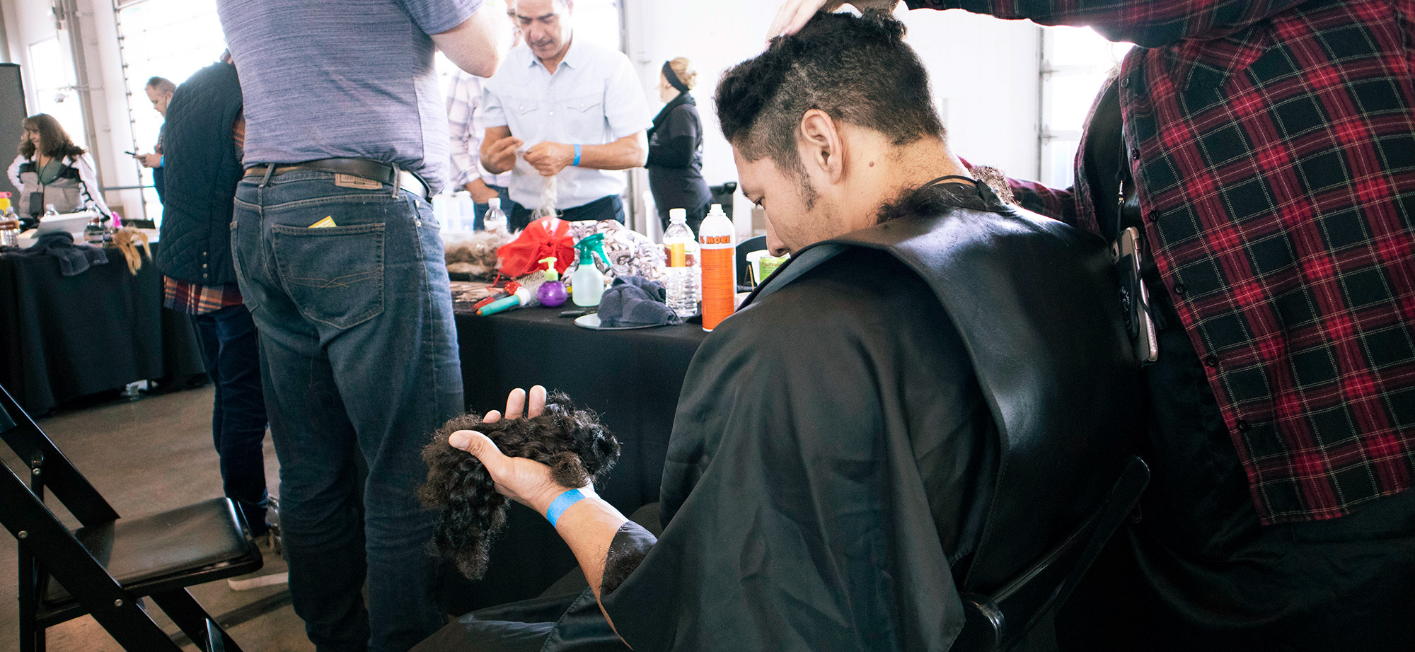 Styling the hair cut at the great cut