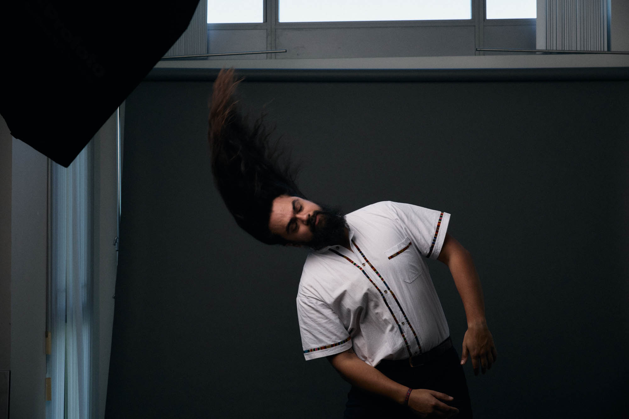 Jose Mejia whipping his hair. By Erica Joan 2024.