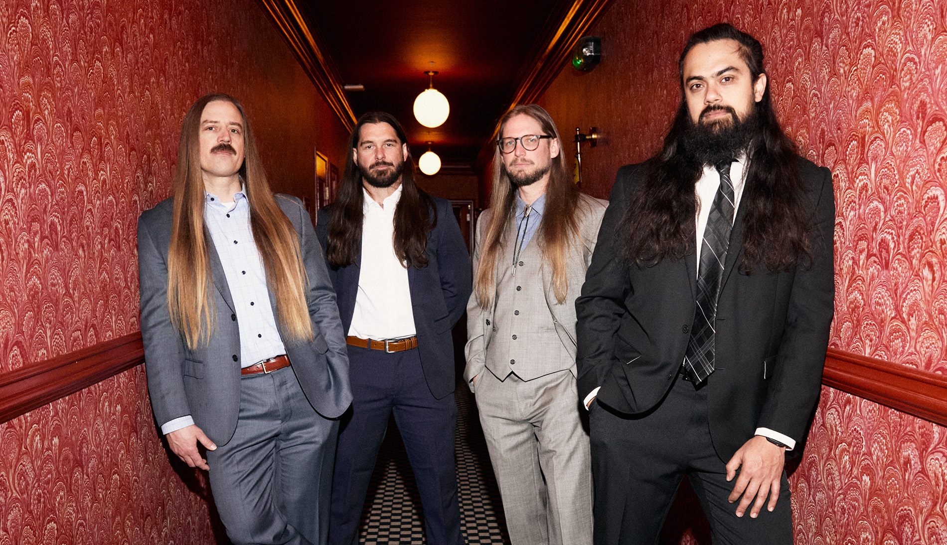 The Longhairs team standing in the hallway of The Lafayette in San Diego